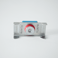 Metallic mute clip with red button on a white background