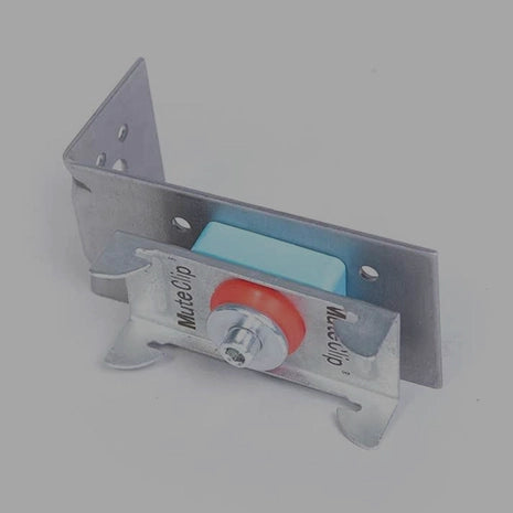 Metal bracket holding a tube of Mate Glo on a gray background