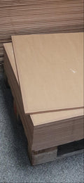 Stack of cardboard boxes on a textured surface